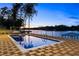 Stunning pool with lakeside views, designed for ultimate relaxation and entertainment at 2746 Emerald Dr, Jonesboro, GA 30236