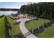 Panoramic aerial shot of the estate highlighting its sprawling grounds, gated entrance, and picturesque lake views at 3085 Lake Park Dr, Jonesboro, GA 30236