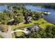 Lakeside estate features an elegant home surrounded by mature trees and manicured lawns at 3085 Lake Park Dr, Jonesboro, GA 30236