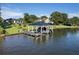 Picturesque waterfront property with boat dock and lift, lush lawn, and a meticulously maintained home at 3085 Lake Park Dr, Jonesboro, GA 30236
