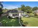 Aerial view of a luxury home with a manicured lawn, pool, and inviting outdoor living space at 3085 Lake Park Dr, Jonesboro, GA 30236