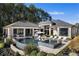 Aerial view showcases a luxury home with a pool, spa, and outdoor living area overlooking mature trees at 3085 Lake Park Dr, Jonesboro, GA 30236