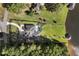 Lakeside estate featuring a modern home, sprawling lawn, and a private dock on the water at 3085 Lake Park Dr, Jonesboro, GA 30236
