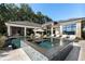 The backyard features a stunning pool and hot tub with a lounge area for outdoor enjoyment and entertaining at 3085 Lake Park Dr, Jonesboro, GA 30236