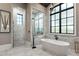 Elegant bathroom with freestanding tub, walk-in shower, and marble accents at 3085 Lake Park Dr, Jonesboro, GA 30236