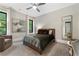 Inviting bedroom with neutral tones, a comfortable chair, natural light, and stylish decor at 3085 Lake Park Dr, Jonesboro, GA 30236