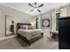 Comfortable bedroom with plush bedding, neutral colors, large windows, and a decorative mirror at 3085 Lake Park Dr, Jonesboro, GA 30236