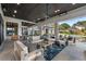 This luxury home has a spacious covered patio with ample seating and serene backyard views at 3085 Lake Park Dr, Jonesboro, GA 30236