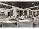 This vast covered patio features an outdoor kitchen, living, and dining area for luxurious entertaining at 3085 Lake Park Dr, Jonesboro, GA 30236