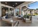 Relax on this home's covered patio with comfortable seating and space for entertaining guests at 3085 Lake Park Dr, Jonesboro, GA 30236