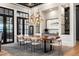 Dining room featuring a large wood table, modern lighting, and built-in storage at 3085 Lake Park Dr, Jonesboro, GA 30236
