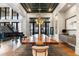 Dining area with a modern chandelier, large wood table, and expansive windows at 3085 Lake Park Dr, Jonesboro, GA 30236