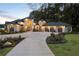 Stunning exterior elevation of this luxurious home with a grand entrance and meticulously landscaped front yard at 3085 Lake Park Dr, Jonesboro, GA 30236
