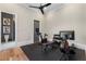 Bright home gym featuring exercise bike, rowing machine, weights, and flat-screen TV for a complete workout experience at 3085 Lake Park Dr, Jonesboro, GA 30236