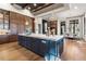Gourmet kitchen featuring a blue kitchen island, white countertops, wood cabinetry and stainless steel appliances at 3085 Lake Park Dr, Jonesboro, GA 30236