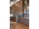 Gourmet kitchen featuring custom wood cabinetry with glass fronts, built-in stainless steel appliances, and hardwood floors at 3085 Lake Park Dr, Jonesboro, GA 30236