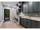 Well-equipped laundry room with modern appliances, ample counter space, and stylish cabinetry at 3085 Lake Park Dr, Jonesboro, GA 30236