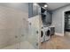 Convenient laundry room with a dog wash station, modern appliances, and custom cabinets at 3085 Lake Park Dr, Jonesboro, GA 30236