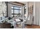 Cozy living room featuring a large window with waterfront views, comfortable seating, and stylish decor at 3085 Lake Park Dr, Jonesboro, GA 30236