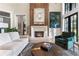 Living room featuring a stone fireplace, statement art, and comfortable furnishings at 3085 Lake Park Dr, Jonesboro, GA 30236