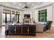 Bright living room featuring a fireplace, large windows, and stylish furniture at 3085 Lake Park Dr, Jonesboro, GA 30236