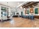 Open concept living space featuring hardwood floors, dining area, fireplace, and gourmet kitchen with large island at 3085 Lake Park Dr, Jonesboro, GA 30236