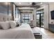 Luxurious main bedroom suite featuring a seating area and large windows with scenic views at 3085 Lake Park Dr, Jonesboro, GA 30236