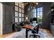 Cozy home office with a large window, built in shelves and comfortable seating at 3085 Lake Park Dr, Jonesboro, GA 30236