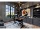 Sophisticated home office with custom built-ins, a large window and a modern desk at 3085 Lake Park Dr, Jonesboro, GA 30236