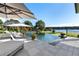 Inviting infinity pool overlooking a picturesque lake, framed by lush landscaping at 3085 Lake Park Dr, Jonesboro, GA 30236