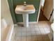 Bathroom with pedestal sink and tiled floor at 3794 W Hayward Ct, Tucker, GA 30084
