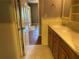 Hall bath with double sinks and wooden cabinetry at 3794 W Hayward Ct, Tucker, GA 30084