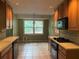 Functional kitchen with wood cabinets and window view at 3794 W Hayward Ct, Tucker, GA 30084