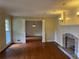 Spacious living room with hardwood floors, fireplace, and elegant trim at 3794 W Hayward Ct, Tucker, GA 30084