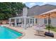 Lovely backyard featuring a swimming pool, comfortable seating, and a relaxing hammock area, ideal for outdoor entertainment at 5928 Edenfield Nw Dr, Acworth, GA 30101