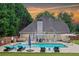 Backyard features a large swimming pool, hot tub, and patio area, ideal for entertaining at 5928 Edenfield Nw Dr, Acworth, GA 30101