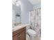 Charming bathroom with decorative shower curtain and granite countertop at 5928 Edenfield Nw Dr, Acworth, GA 30101