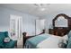 Serene bedroom with a decorative bed frame, comfortable seating, and a view into the bathroom, offering relaxation at 5928 Edenfield Nw Dr, Acworth, GA 30101
