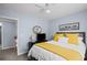 Comfortable bedroom with ceiling fan, plush bedding, and hardwood floors at 5928 Edenfield Nw Dr, Acworth, GA 30101