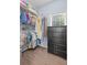 Walk-in closet with custom shelving and hardwood floors at 5928 Edenfield Nw Dr, Acworth, GA 30101
