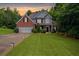 Charming two-story brick home with a manicured lawn and attached two-car garage at 5928 Edenfield Nw Dr, Acworth, GA 30101