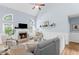 Bright living room with vaulted ceiling, fireplace, hardwood floors and elegant furniture arrangement at 5928 Edenfield Nw Dr, Acworth, GA 30101