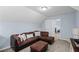 Cozy living room with a sectional sofa, an ottoman, offering comfortable seating, and a relaxed atmosphere at 5928 Edenfield Nw Dr, Acworth, GA 30101