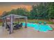 Inviting backyard with a swimming pool, outdoor seating, and lush greenery, creating a perfect outdoor retreat at 5928 Edenfield Nw Dr, Acworth, GA 30101