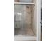 Contemporary shower with tile surround and glass door at 5928 Edenfield Nw Dr, Acworth, GA 30101