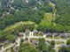 A beautiful aerial view of a golf course community with lush greenery and well-maintained homes at 2510 Wood Creek Ct, Dacula, GA 30019