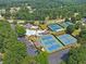 Aerial view of the community amenities including pools, tennis courts and clubhouse at 2510 Wood Creek Ct, Dacula, GA 30019