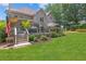 A spacious deck looks over a manicured backyard with plush green lawn at 2510 Wood Creek Ct, Dacula, GA 30019