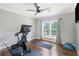 Bright workout room with hardwood floors, natural light, and exercise equipment, promoting a healthy lifestyle at 2510 Wood Creek Ct, Dacula, GA 30019
