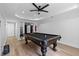 Finished basement game room features a pool table, recessed lighting, and fan. Provides a fun space for recreation at 2510 Wood Creek Ct, Dacula, GA 30019